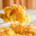Close-up forkful of baked pineapple casserole dish