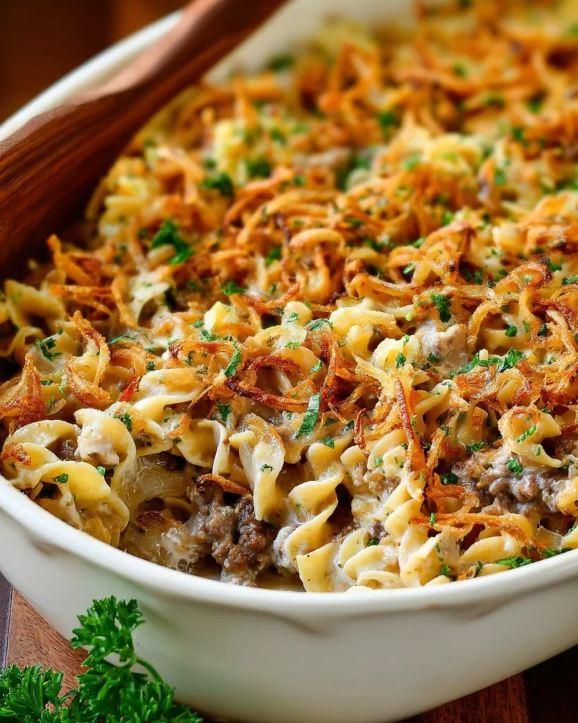 Close-up of baked French Onion Beef Casserole with golden crispy onions